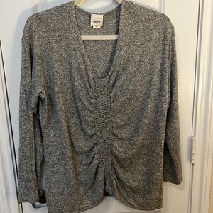 Daytrip heathered Grey light sweater with rouched front detail. V-neck.